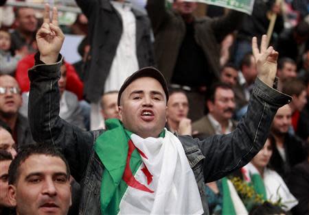 A protester shouts slogans while calling for a boycott of the Algerian presidential election in Algiers March 21, 2014. REUTERS/Louafi Larbi