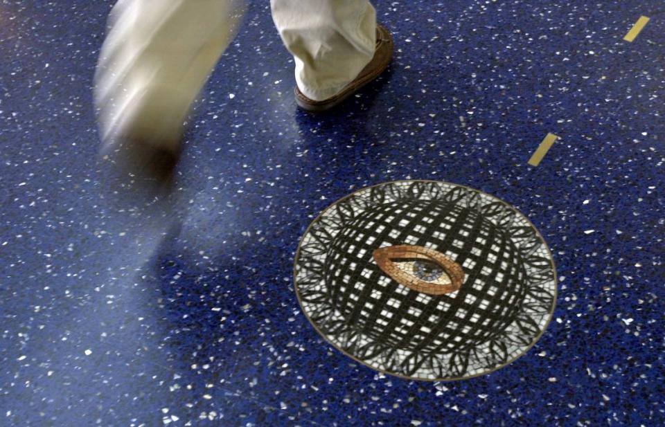 The blue terrazzo floors in the terminals at Kansas City International Airport featured mosaic medallions inset into the floor, giving travelers a reason to look down as they passed through the airport.