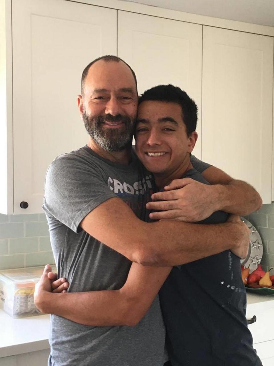 Hersh Goldberg-Polin, an American citizen kidnapped by Hamas, embraces his father, Jonathan Polin.