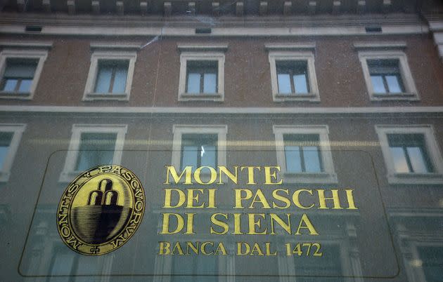 The logo of the Monte dei Paschi di Siena bank is seen on the window of a branch in downtown Rome on February 09, 2017. - Banca Monte dei Paschi di Siena S.p.A. (BMPS) is the oldest surviving bank in the world and the third largest Italian commercial and retail bank by total assets. Founded in 1472 by the magistrates of the city state of Siena, as a 