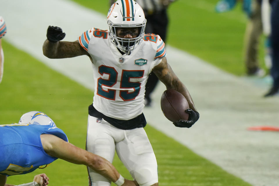 Miami Dolphins cornerback Xavien Howard (25) runs after intercepting a pass during the second half of an NFL football game against the Los Angeles Chargers, Sunday, Nov. 15, 2020, in Miami Gardens, Fla. (AP Photo/Lynne Sladky)