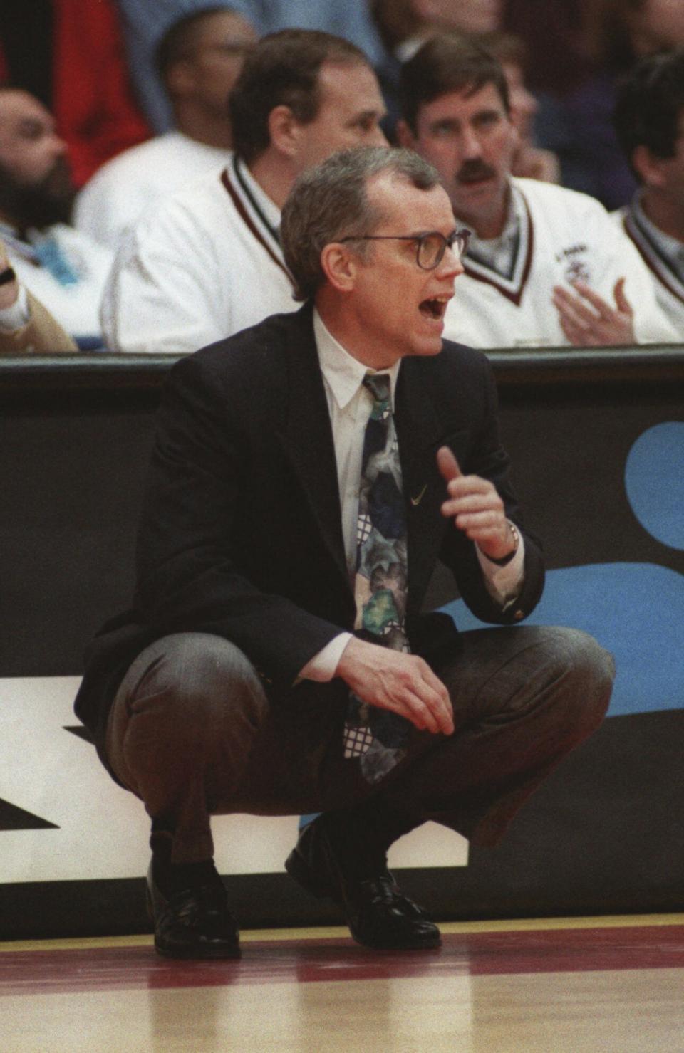 FILE - DePaul head coach Joey Meyer directs his team against Memphis during the first half of an NCAA college basketball game Feb. 1, 1996, in Rosemont, Ill. Meyer, who played at DePaul and coached the Blue Demons to seven NCAA Tournament appearances in 13 seasons, has died. He was 74. Meyer died Friday, Dec. 29, 2023, in the Chicago suburb of Hinsdale, surrounded by family, DePaul said in a release. (AP Photo/Fred Jewell)