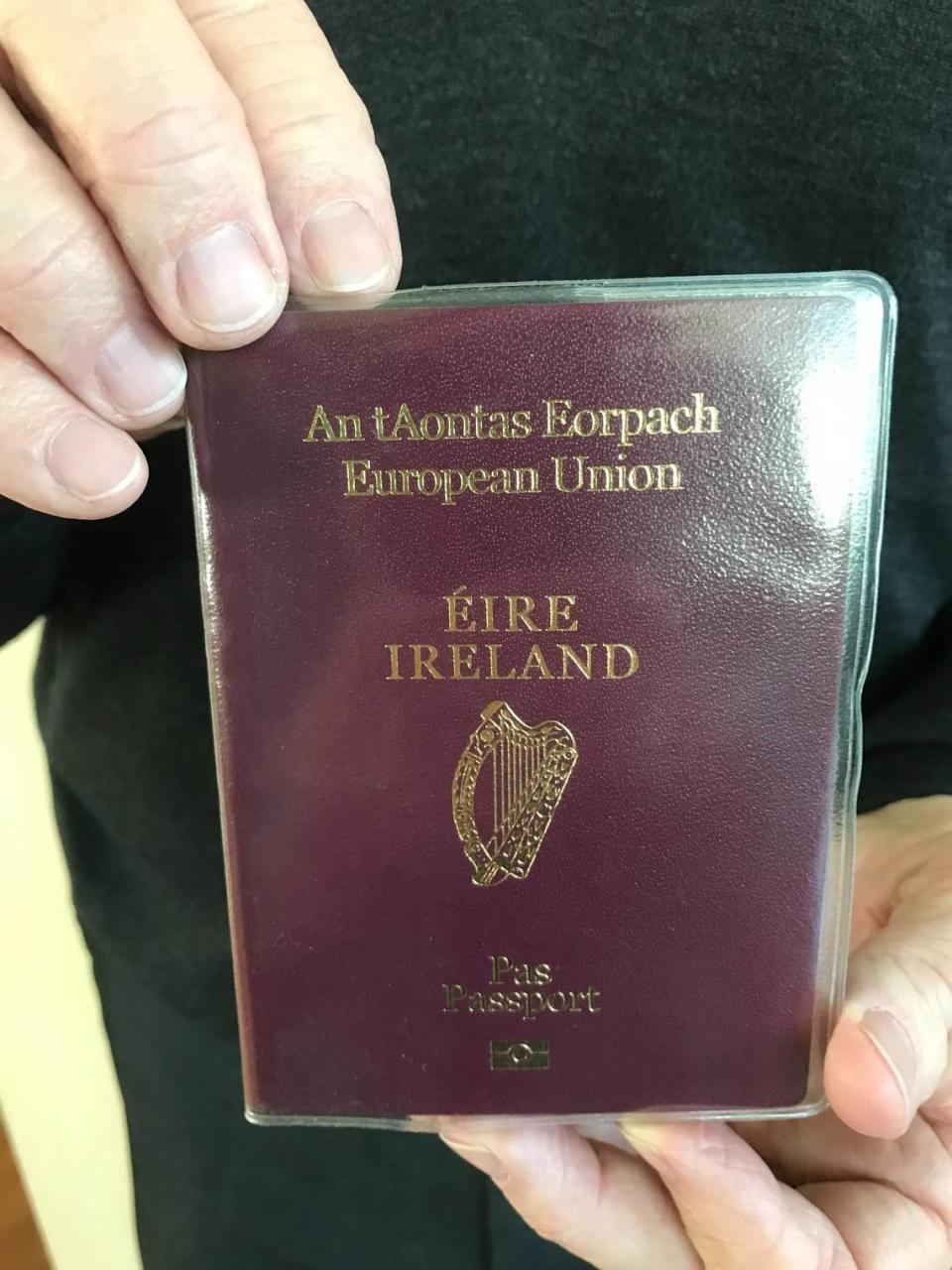 Mike Lyons of Cambria holds his Irish passport. He applied for and got dual citizenship in the United States and Ireland.