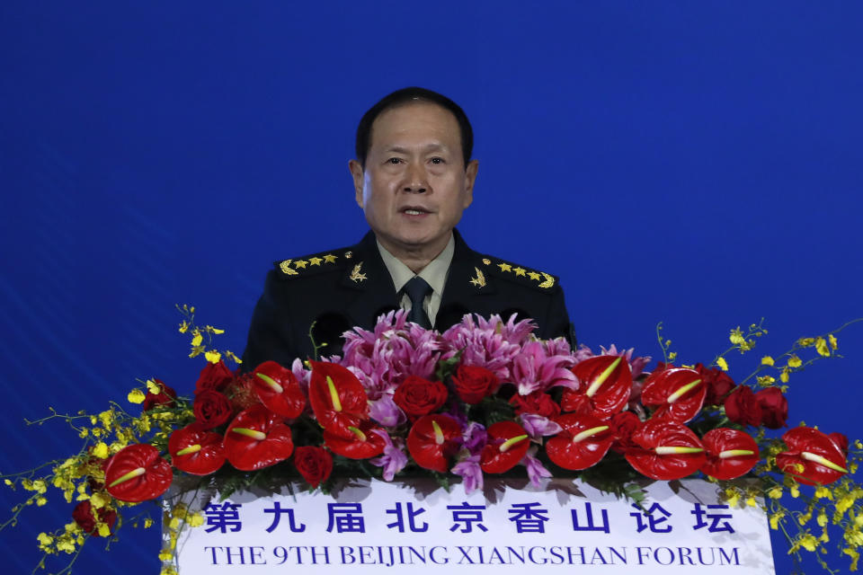 Chinese Defense Minister Wei Fenghe delivers his opening speech for the Xiangshan Forum, a gathering of the region's security officials, in Beijing, Monday, Oct. 21, 2019. Wei issued a stinging rebuke of the U.S. at a defense forum in Beijing, saying China wasn't fazed by sanctions, pressure and a "big stick policy." (AP Photo/Andy Wong)