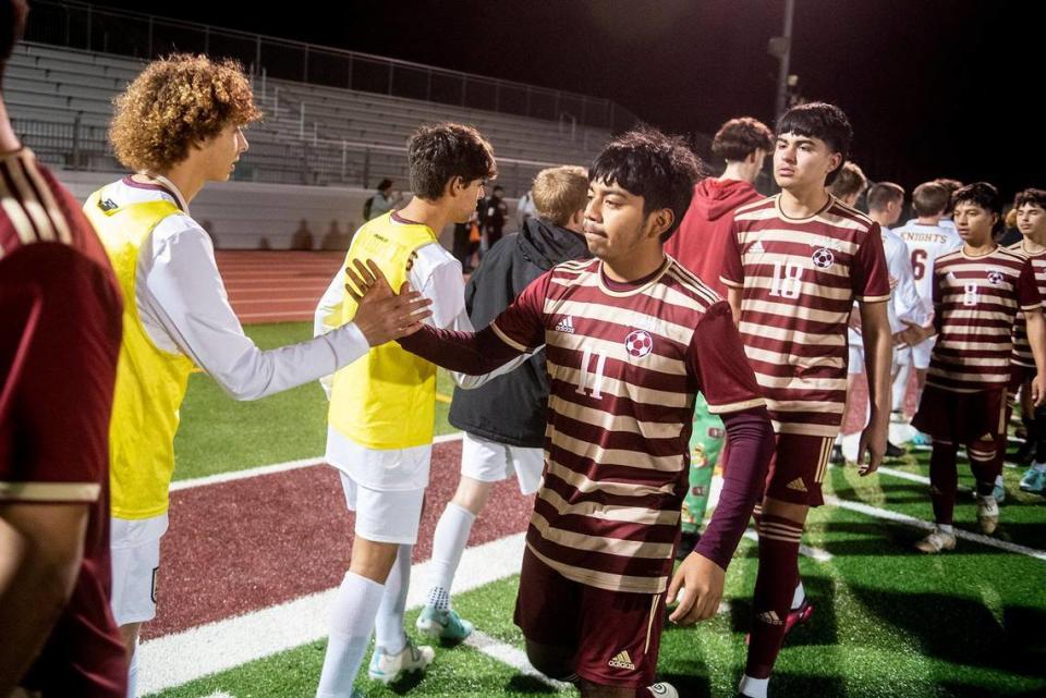 Golden Valley senior Guillermo Hernandez (11) shakes hands with Las Lomas players after the Knights beat the Cougars 3-1 on penalty kicks during a NorCal Regional playoff game at Golden Valley High School in Merced, Calif., on Tuesday, Feb. 27, 2024.