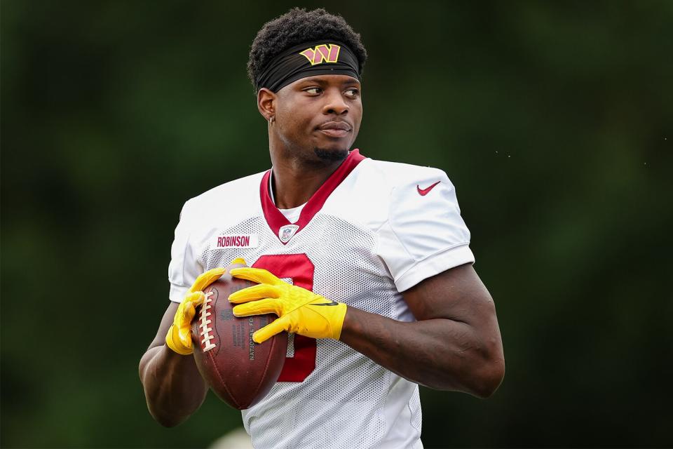 Brian Robinson #8 of the Washington Commanders participates in a drill during training camp at INOVA Sports Performance Center on August 17, 2022 in Ashburn, Virginia.