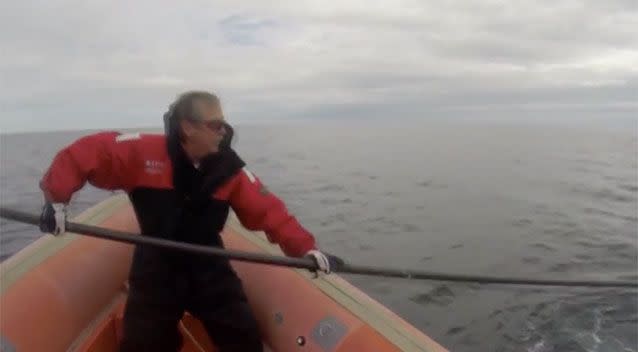 Mr Howlett at work rescuing a whale, on an earlier trip. Photo: CBC News