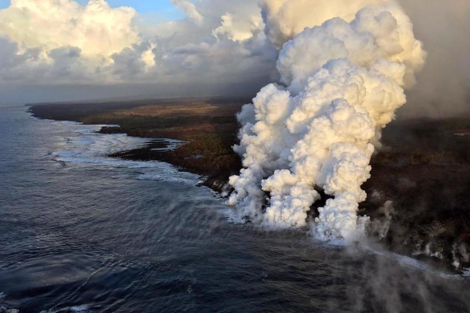 plumes rising where lava pours into the sea on the south margin of the fissure flow of the Kilauea volcano, (AFP/Getty Images)