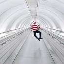 Clicking his heels on the London Underground.