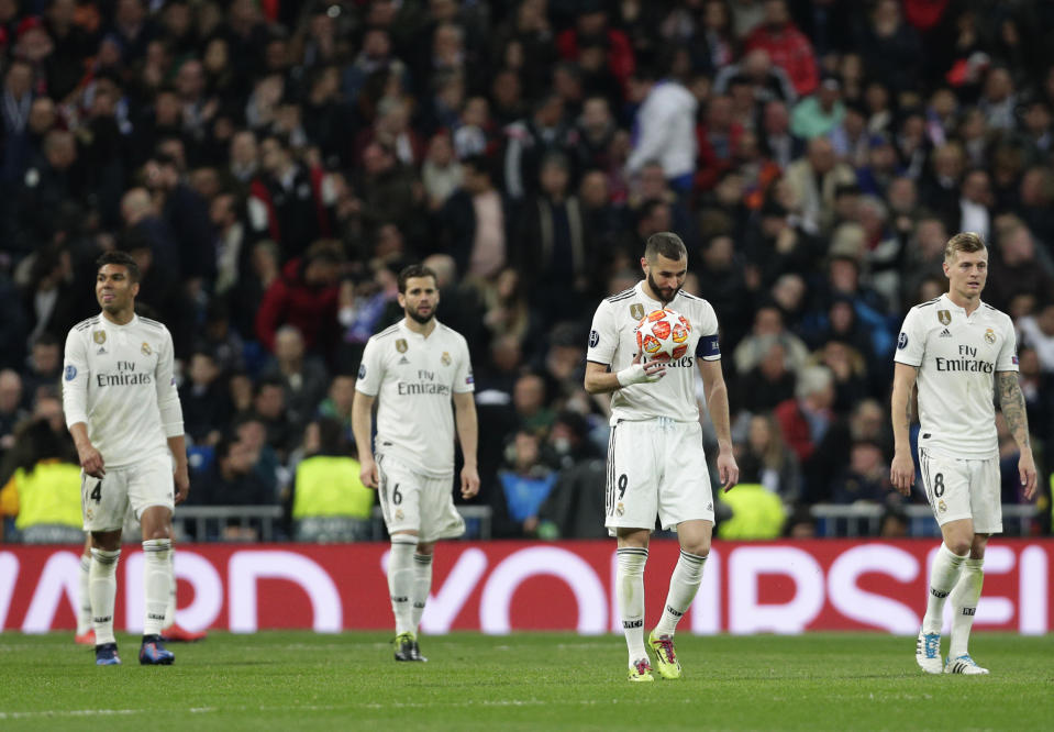 Real forward Karim Benzema holds the ball after being scored by Ajax, during the Champions League soccer match between Real Madrid and Ajax at the Santiago Bernabeu stadium in Madrid, Spain, Tuesday, March 5, 2019. (AP Photo/Manu Fernandez)