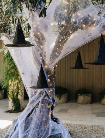 <p>Khloe Kardashian/Instagram</p> Witch hats appeared to be floating near Kardashian's trees.