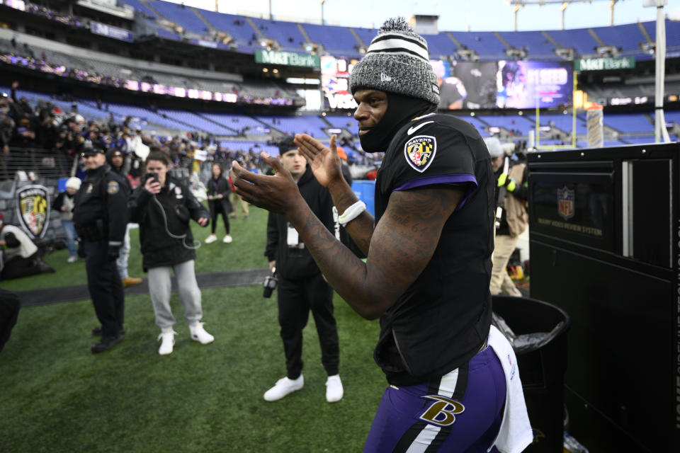 Baltimore Ravens quarterback Lamar Jackson celebrates after an NFL football game against the Miami Dolphins in Baltimore, Sunday, Dec. 31, 2023. (AP Photo/Nick Wass)