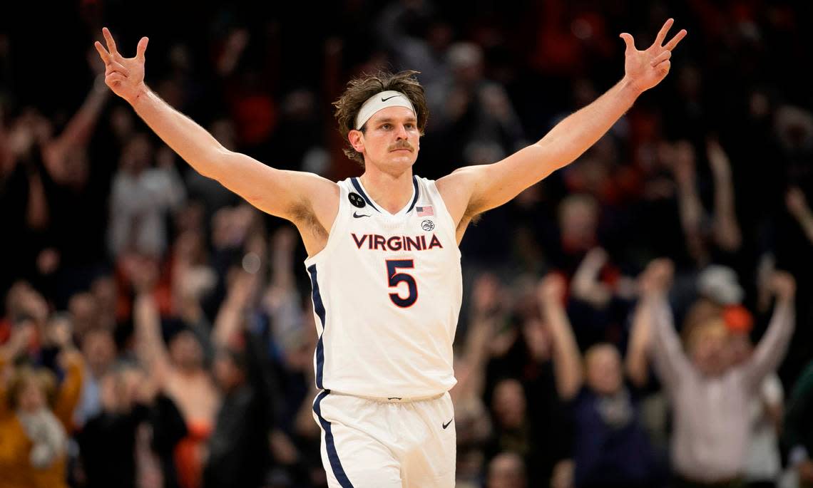 Virginia’s Ben Vander Plas (5) reacts after sinking a three point basket to give the Cavaliers a 42-40 lead in the second half. North Carolina would never regain the lead, falling 65-58 on Tuesday, January 10, 2023 at John Paul Jones Arena in Charlottesville, Va.