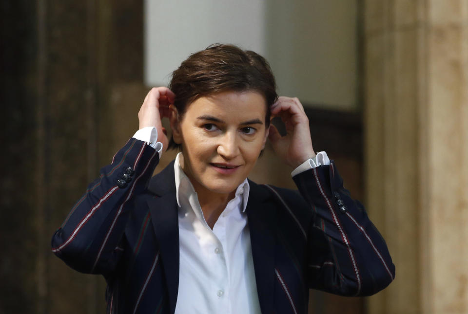 In this photo taken on Monday, April 23, 2018, Serbia's Prime Minister Ana Brnabic gestures, at the Serbian Parliament building in Belgrade, Serbia. The office of Serbia's openly gay Prime Minister Ana Brnabic says her partner has given birth to a baby boy. A brief statement says the delivery on Wednesday, Feb. 20, 2019 went well and both the mother, Milica Djurdjic, and the baby are "doing fine." (AP Photo/Darko Vojinovic)