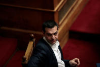 Greek Prime Minister Alexis Tsipras attends a parliamentary session before a vote on setting up a special committee which will probe the role of ten politicians in a case which involves alleged bribery by Swiss drugmaker Novartis, in Athens, Greece, February 21, 2018. REUTERS/Alkis Konstantinidis