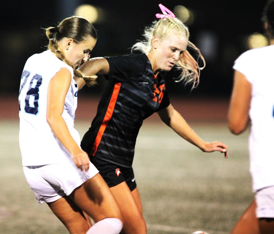 Cincinnati Country Day senior Melissa Teke (28) challenges Waynesville senior Samantha Erbach (26) during Waynesville's 5-3 win over Cincinnati Country Day Sept. 26, 2023 at Waynesville High School. CCD and Waynesville hope to get back to the state finals in November.