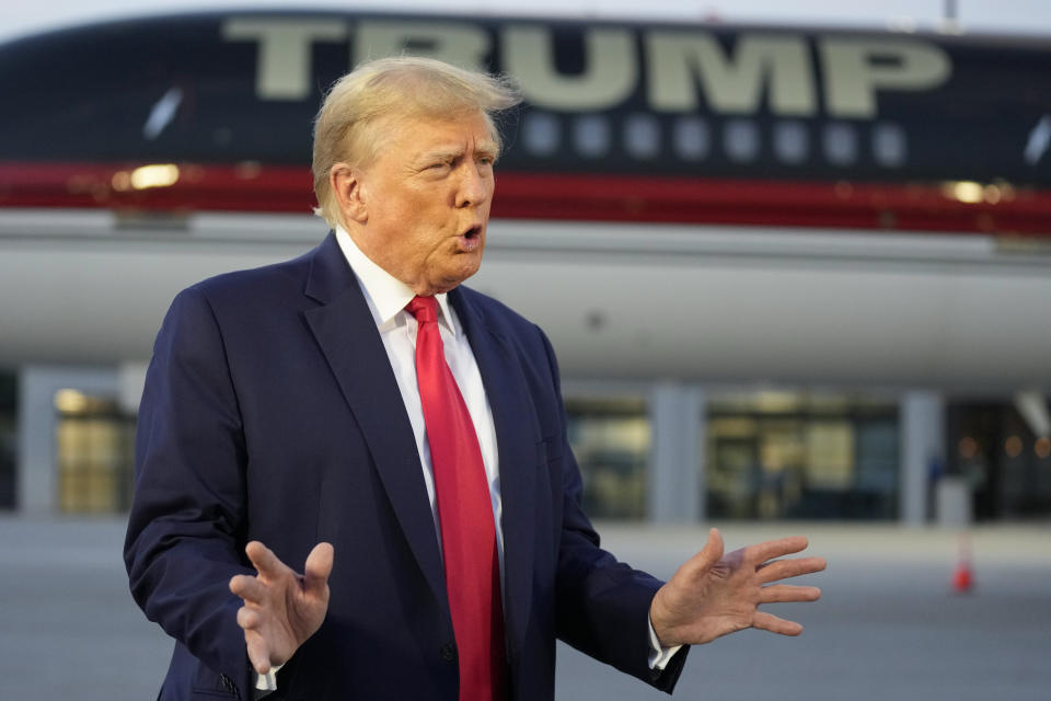 Former President Donald Trump speaks with reporters before departure from Hartsfield-Jackson Atlanta International Airport, Thursday, Aug. 24, 2023, in Atlanta. (AP Photo/Alex Brandon)