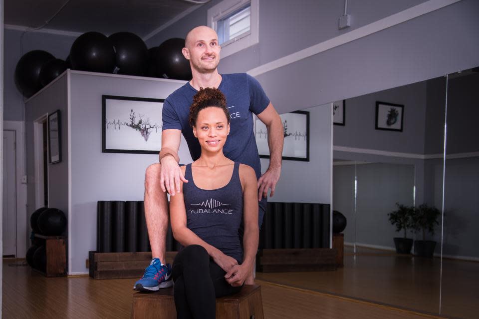 Rory Cox and his wife Shala pose in one of a trio of YuBalance fitness studios they own in San Francisco. The couple is concerned the city will have a hard time bouncing back from the pandemic after residents and tech companies have left over the past months.