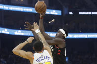 Toronto Raptors forward Pascal Siakam, right, shoots over Golden State Warriors forward Juan Toscano-Anderson (95) during the first half of an NBA basketball game in San Francisco, Thursday, March 5, 2020. (AP Photo/Jeff Chiu)
