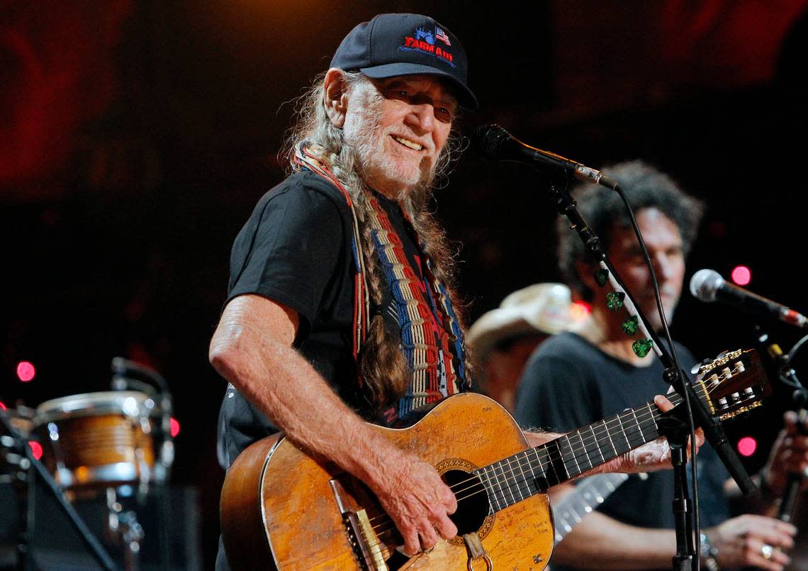 Willie Nelson plays at the Farm Aid concert held at Walnut Creek Amphitheatre in Raleigh in 2014.