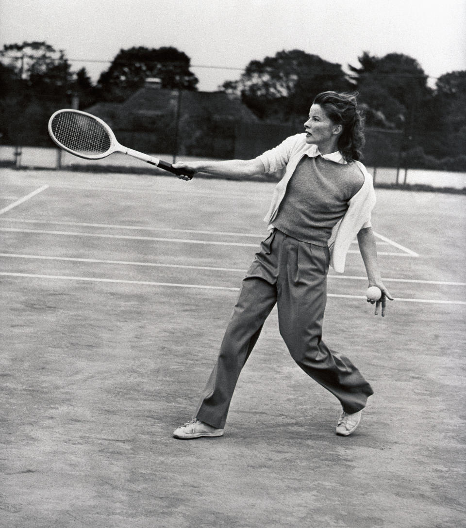 Katharine Hepburn, screen and stage star, returns a drive during a friendly game of tennis at the Merion Cricket Club in Philadelphia, 1940.&nbsp;