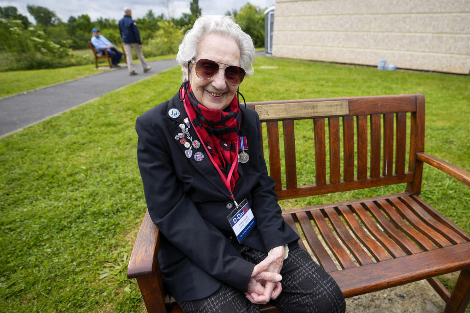 British World War II veteran Marie Scott poses during a service at the Pegasus Bridge memorial in Benouville, Normandy, France, Wednesday, June 5, 2024. World War II veterans from across the United States as well as Britain and Canada are in Normandy this week to mark 80 years since the D-Day landings that helped lead to Hitler's defeat. (AP Photo/Virginia Mayo)