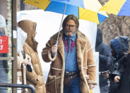 <p>Nick Offerman does his TV show's name justice as he blocks out rain to film season 4 of <em>The Umbrella Academy</em> on March 27 in Toronto. </p>