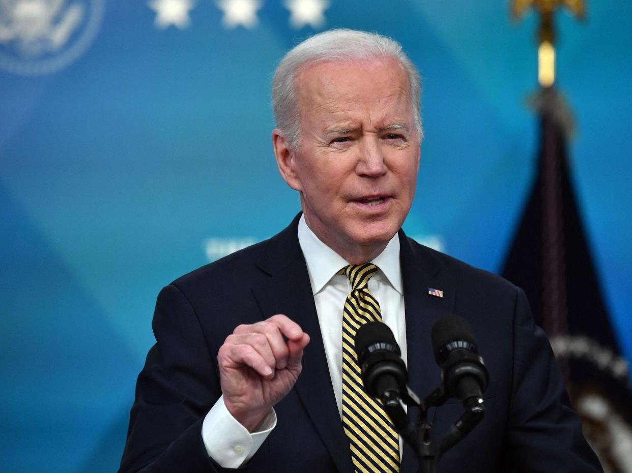 President Joe Biden speaking about Ukraine wearing a green tie.