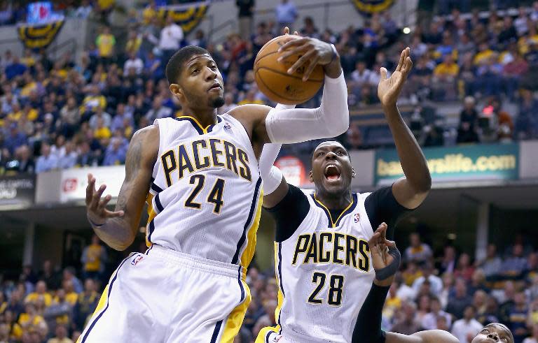 Paul George of the Indiana Pacers grabs a rebound against the Atlanta Hawks at Bankers Life Fieldhouse on April 22, 2014 in Indianapolis, Indiana