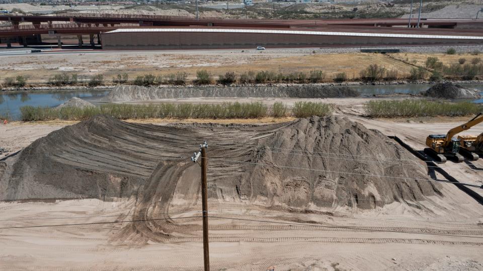 Heavy equipment moves earth in the Rio Grande in Sunland Park, New Mexico on April 4, 2022. 