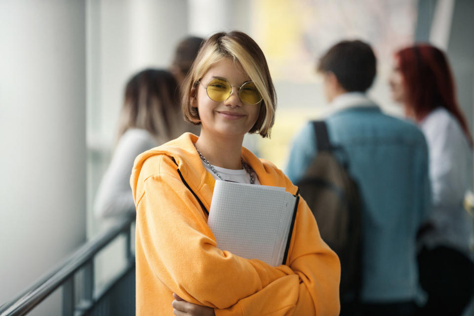 College student walking and carrying books