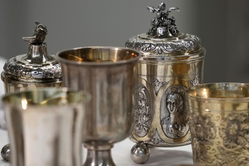 Some of the 111 silver objects stolen by the Nazis from the Jews during the Third Reich, stand at the Bavarian National Museum in Munich, Germany, Saturday, June 10, 2023. Museum staff have made it their mission to return as many of the silver objects as possible to the descendants of the original owners. (AP Photo/Matthias Schrader)