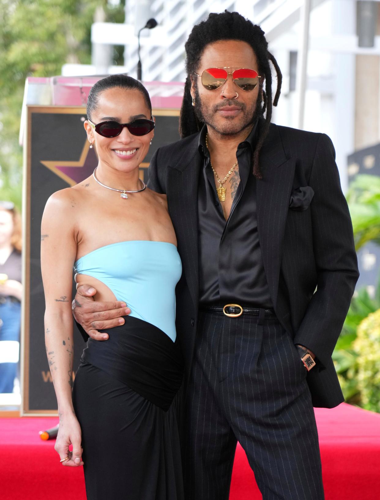 Kravitz, left, poses with her father Lenny Kravitz at a ceremony honoring him with a star on the Hollywood Walk of Fame on March 12, 2024.