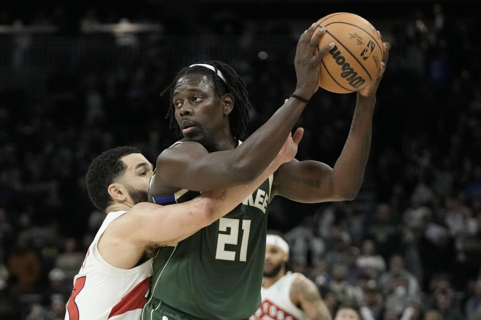 Milwaukee Bucks' Jrue Holiday is fouled by Toronto Raptors' Fred VanVleet during the second half of an NBA basketball game Tuesday, Jan. 17, 2023, in Milwaukee. The Bucks won 130-122. (AP Photo/Morry Gash)