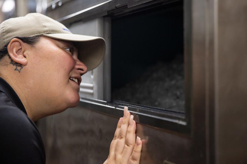 Joanie Garza, a public health inspector with the city, looks inside of an ice machine during a restaurant inspection on June, 6 2023, in Corpus Christi, Texas.