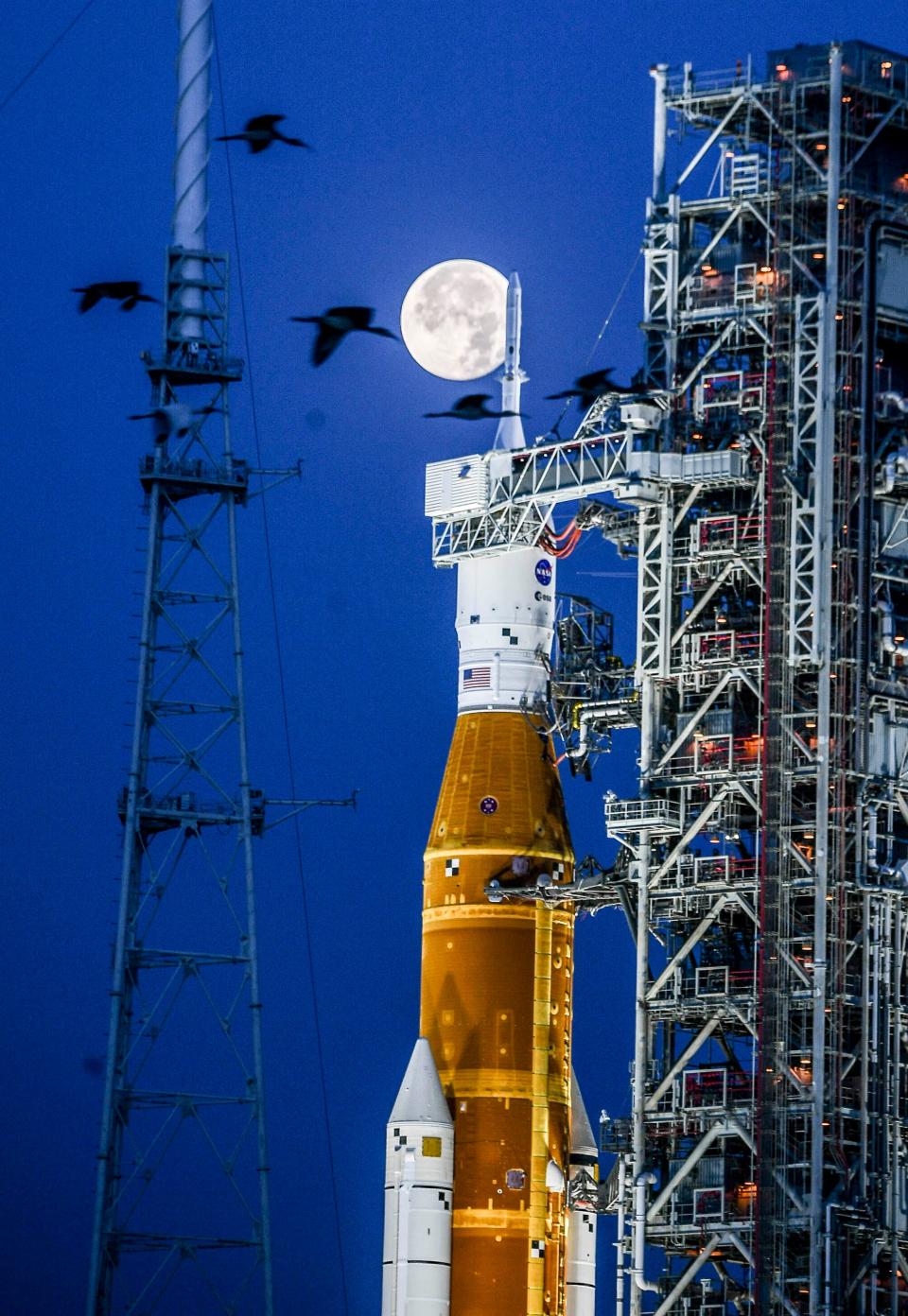 The first full moon in June called the  Strawberry Moon sets over the Orion capsule atop NASA’s Space Launch System rocket at Kennedy Space Center, FL  Wednesday, June 15, 2022. Craig Bailey/FLORIDA TODAY via USA TODAY NETWORK
