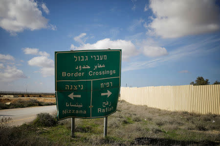 FILE PHOTO: Road sign pointing to the directions of border crossings, positioned next to the entrance of the Kerem Shalom border crossing terminal, Israel January 16, 2018. REUTERS/Amir Cohen/File Photo