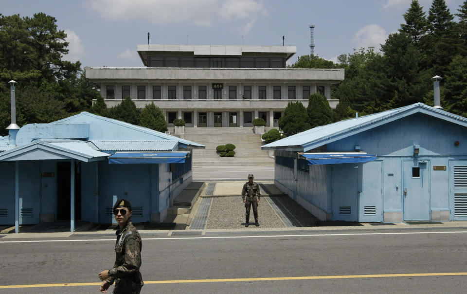 In this June 12, 2019, photo, South Korean soldiers stand during a press tour at the border village of Panmunjom in the Demilitarized Zone, South Korea. South Korea says two of four North Korean fishermen who were rescued off a boat drifting in South Korean waters will remain in the country after expressing their desire to defect. Seoul's Unification Ministry on Tuesday, June 18, 2019 said the two other fishermen were sent back to North Korea through the inter-Korean village. (AP Photo/Lee Jin-man)