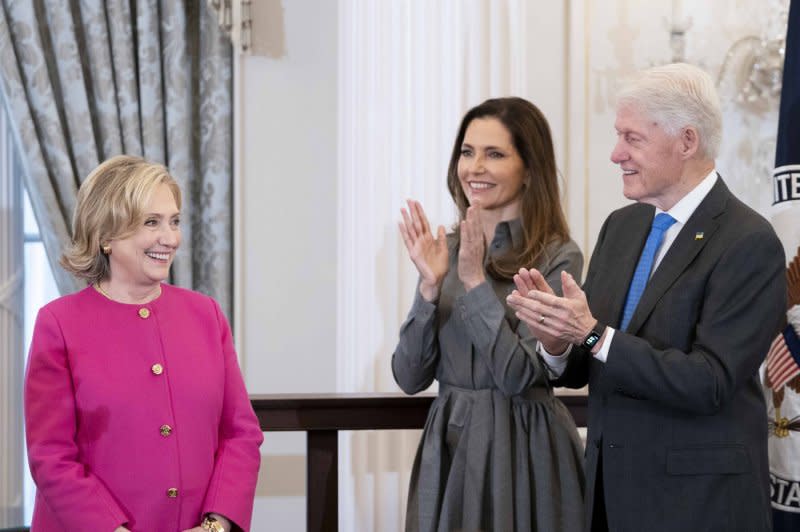 Former Secretary of State Hillary Rodham Clinton; Evan Ryan, wife of Blinken; and former President Bill Clinton attend the former first lady and U.S. Senator's portrait unveiling Tuesday at the U.S. State Department in Washington, D.C. Photo by Bonnie Cash/UPI