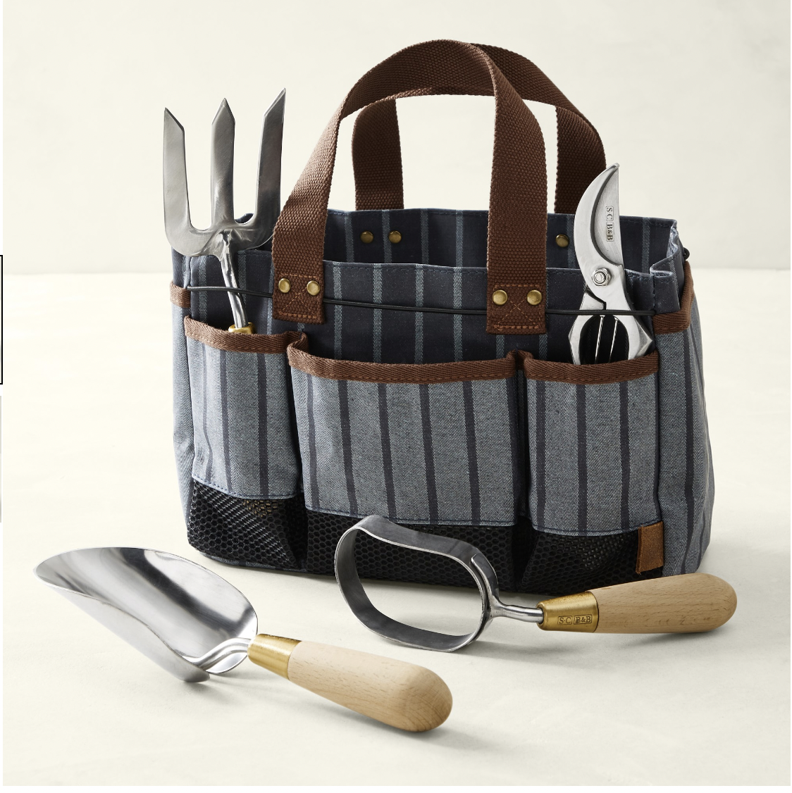 <p><a href="https://go.redirectingat.com?id=74968X1596630&url=https%3A%2F%2Fwww.williams-sonoma.com%2Fproducts%2Fsophie-conran-tool-bag-and-essential-tools-set&sref=https%3A%2F%2Fwww.esquire.com%2Flifestyle%2Fg60454648%2Fbest-gifts-for-gardeners%2F" rel="nofollow noopener" target="_blank" data-ylk="slk:Shop Now;elm:context_link;itc:0;sec:content-canvas" class="link rapid-noclick-resp">Shop Now</a></p><p>Tool Bag and Essential Tools Set</p><p>williams-sonoma.com</p><p>$229.95</p>