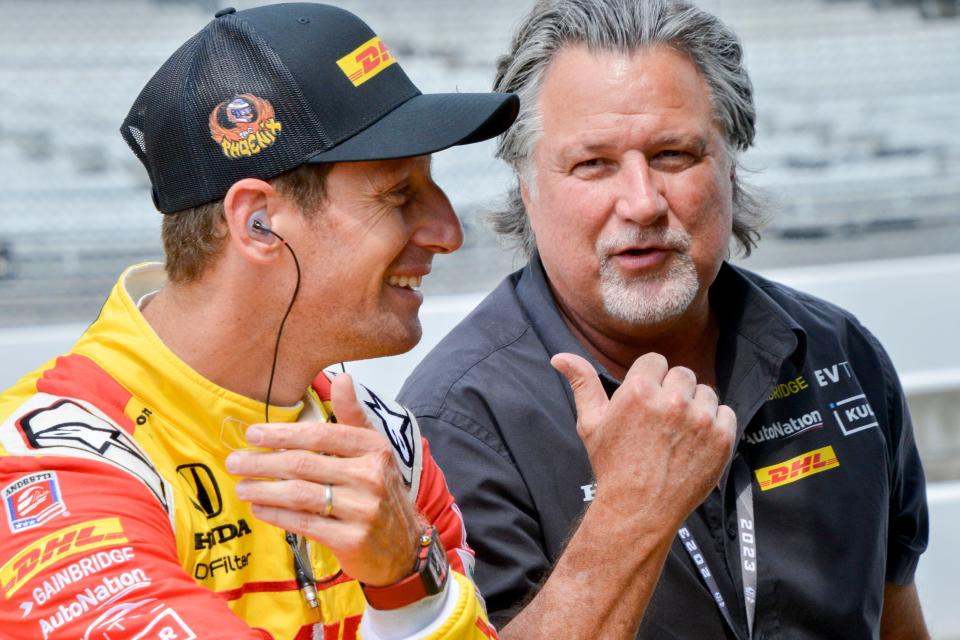 Andretti Autosport driver Romain Grosjean (28) talks with Michael Andretti in his pit box Friday, Aug. 11, 2023, during qualifying for the Gallagher Grand Prix at Indianapolis Motor Speedway.
