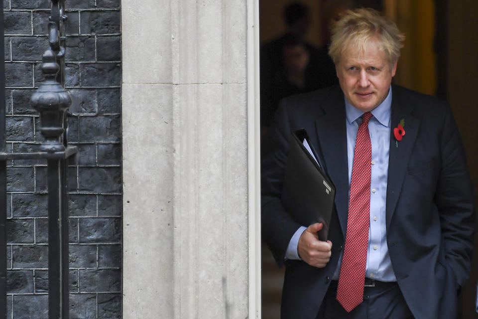 Britain's Prime Minister Boris Johnson leaves 10 Downing Street on his way to the Houses of Parliament in London, Tuesday, Oct. 29, 2019. Britain appeared on course Tuesday for an early general election that could break the country's political deadlock over Brexit, after the main opposition Labour Party said it would agree to the government's request to send voters to the polls in December.  (AP Photo/Alberto Pezzali)