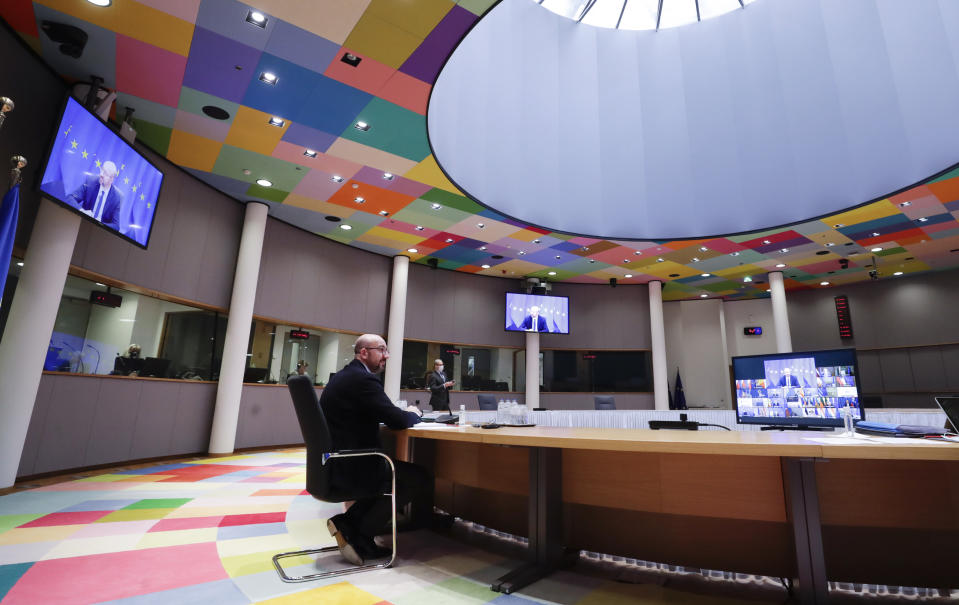 European Council President Charles Michel speaks with EU leaders during an EU summit, via videoconference link, at the European Council building in Brussels, Thursday, Feb. 25, 2021. European Union leaders are gathering Thursday, via videoconference link, to try to inject new energy into the 27-nation bloc's lagging coronavirus vaccination effort as concern mounts that new variants might spread faster than authorities can adapt. (Olivier Hoslet, Pool via AP)