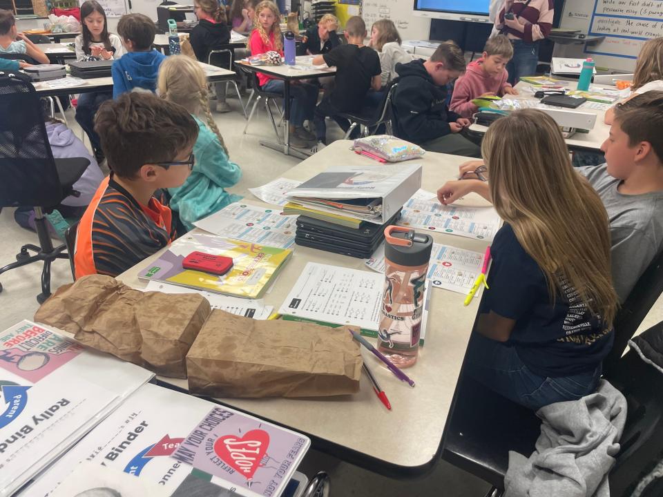 Belle River Elementary School fifth graders play the bean game, a budgeting game where beans represent money, on Oct. 12, 2023.