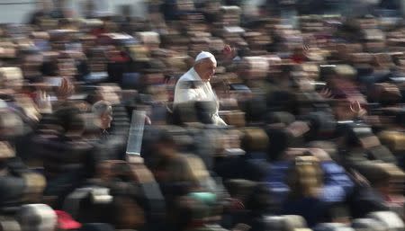 Pope Francis arrives to lead the general audience in St. Peter's Square at the Vatican March 11, 2015. REUTERS/Stefano Rellandini