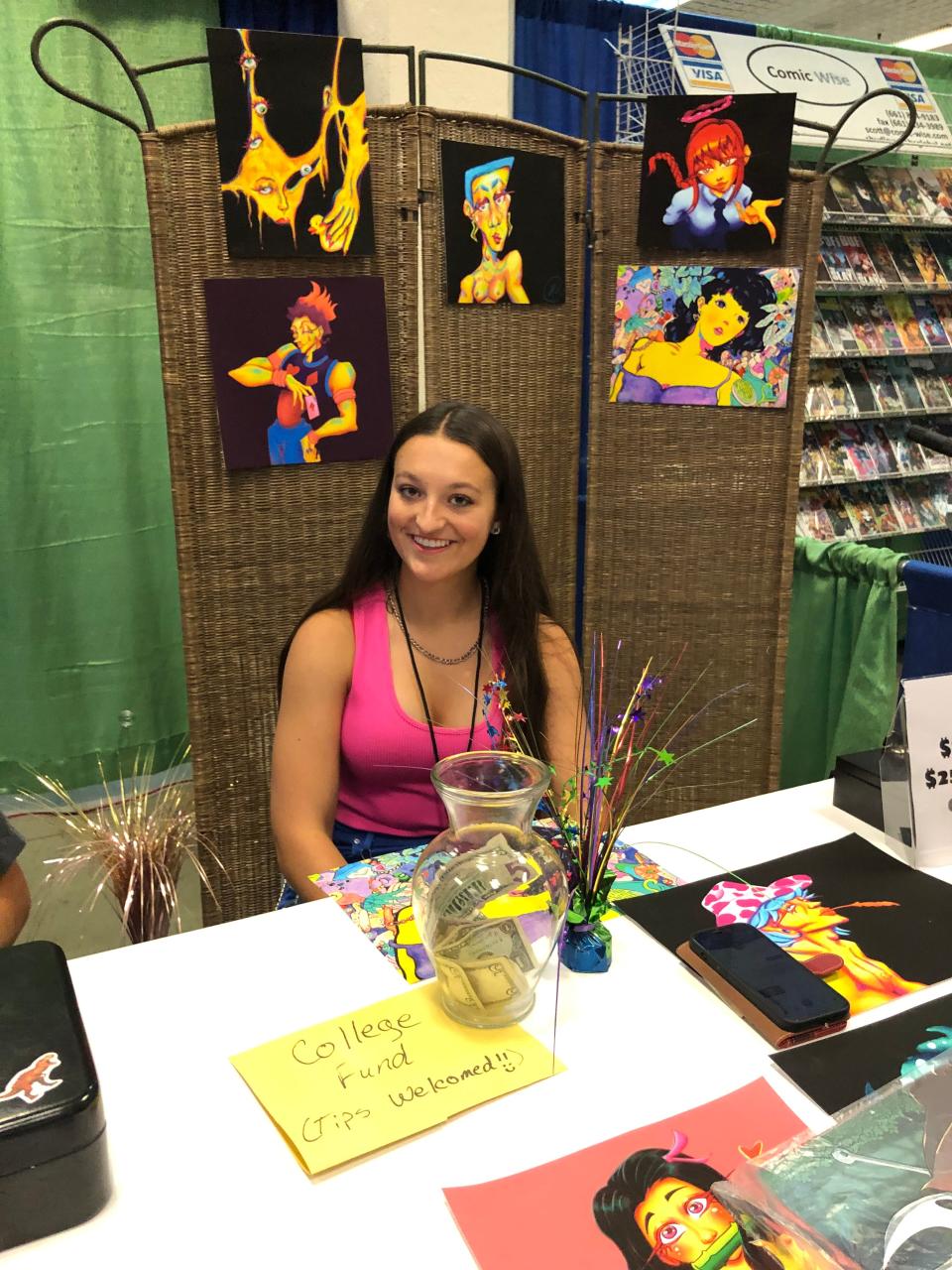The artist at Fritz Tooth Art booth, Abigayle Stubby-Kurn, is selling her artwork for college tuition. She was one of several vendors at the 2023 AMA-CON.