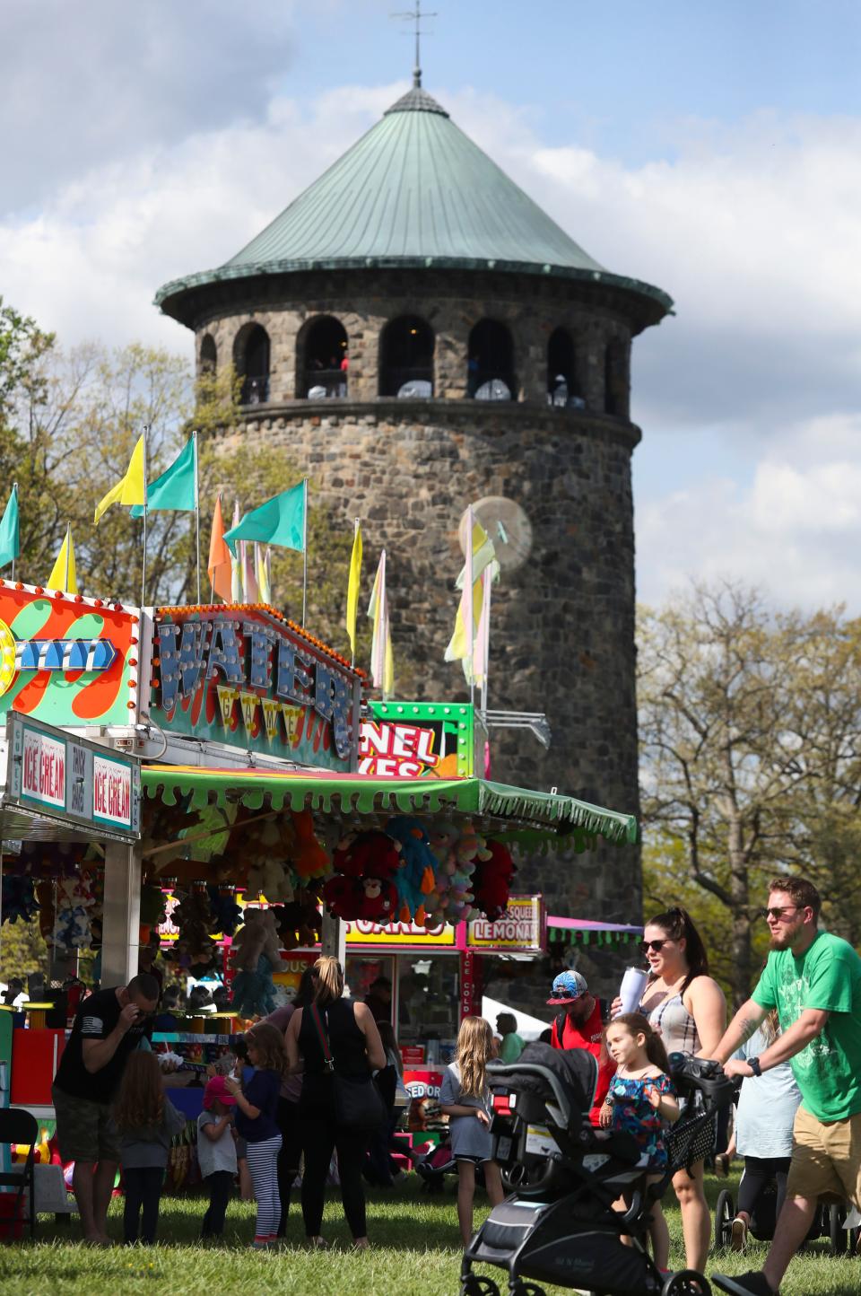 The Rockford Tower serves as stately backdrop on the first day of the Wilmington Flower Market in Rockford Park, Thursday, May 5, 2022.