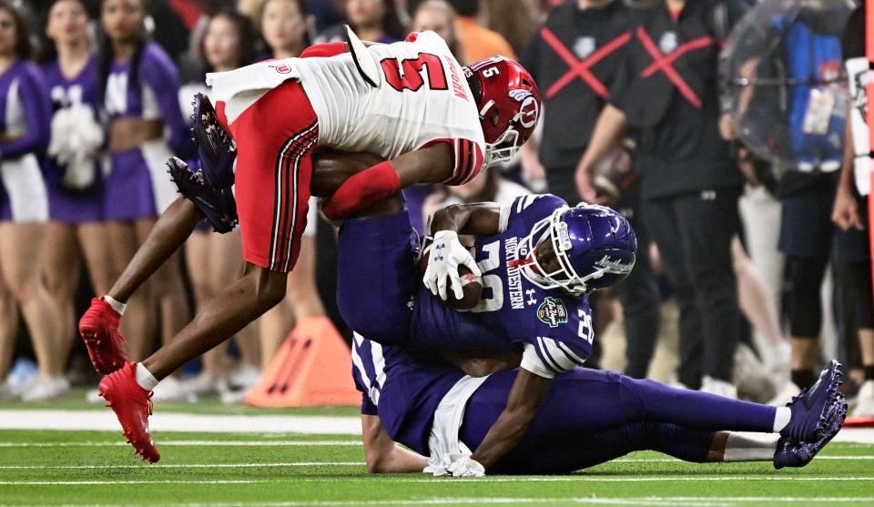 Utah Utes cornerback Zemaiah Vaughn (5) brings down Northwestern Wildcats running back Joseph Himon II (20) as Utah and Northwestern play in the SRS Distribution Las Vegas Bowl on Saturday, Dec. 23, 2023. | Scott G Winterton, Deseret News