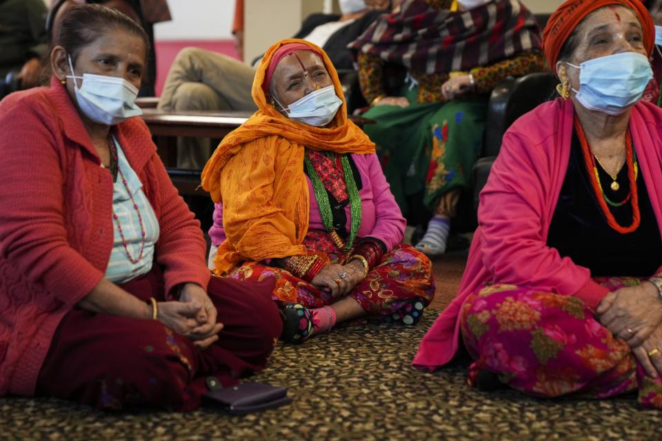 Residents listen as health professionals from Ohio State University's Wexner Medical Center speak with Bhutanese people during a community health session at Himalayan Day Care.