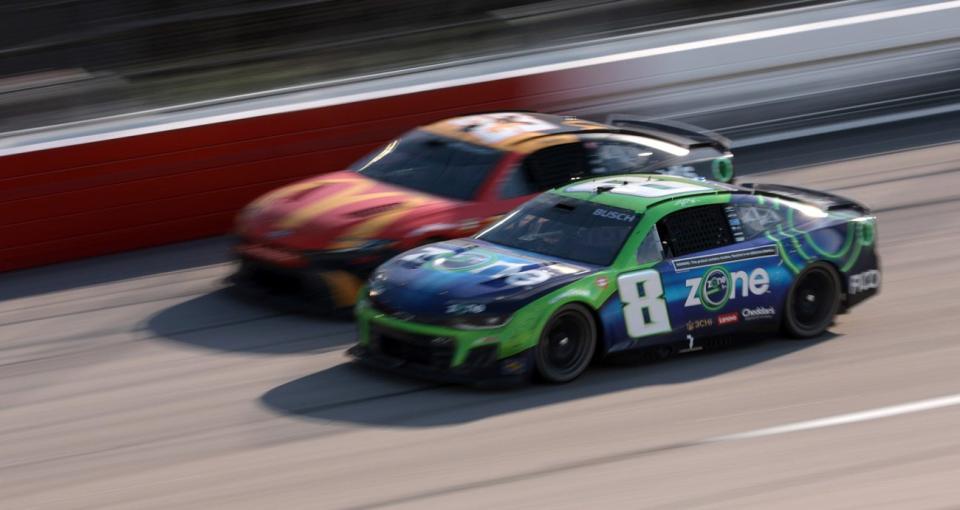 Kyle Busch and Bubba Wallace compete in a NASCAR race.